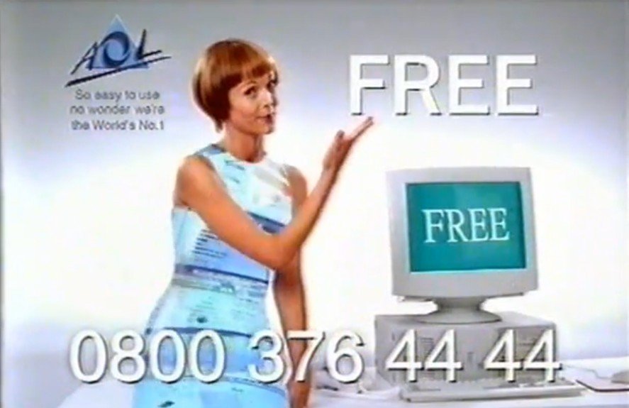 A low resolution screenshot of AOL's millennial mascot, Connie, taken from a 2000 advert. She is wearing her digital dress that displays AOL content, and the word FREE is liberally displayed around the place.
