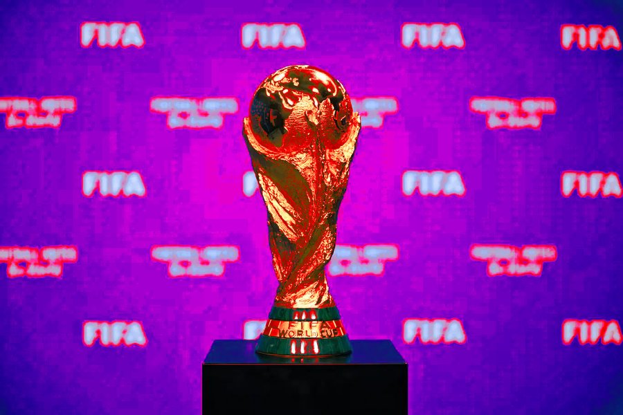 A photograph of the Jules Rimet trophy on display in front of a FIFA hoarding. I've messed with the colour balance to make it look unpleasant.